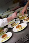 Plating up the dessert: pineapple tart tatin with ginger ice cream, coconut tuille and pineapple salsa
