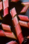 Slices of forced rhubarb gently macerate in the poaching liquid